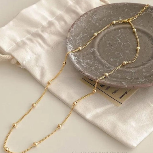 Collier ras du cou chaine de perles dorée