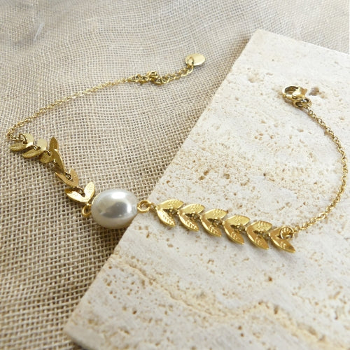 Bracelet plumes dorés et perle blanche