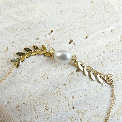 Bracelet feuilles dorées et perle blanche