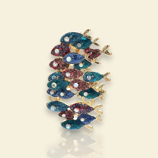 broche dorée Nérée, une broche pour vêtements d’un banc de poissons